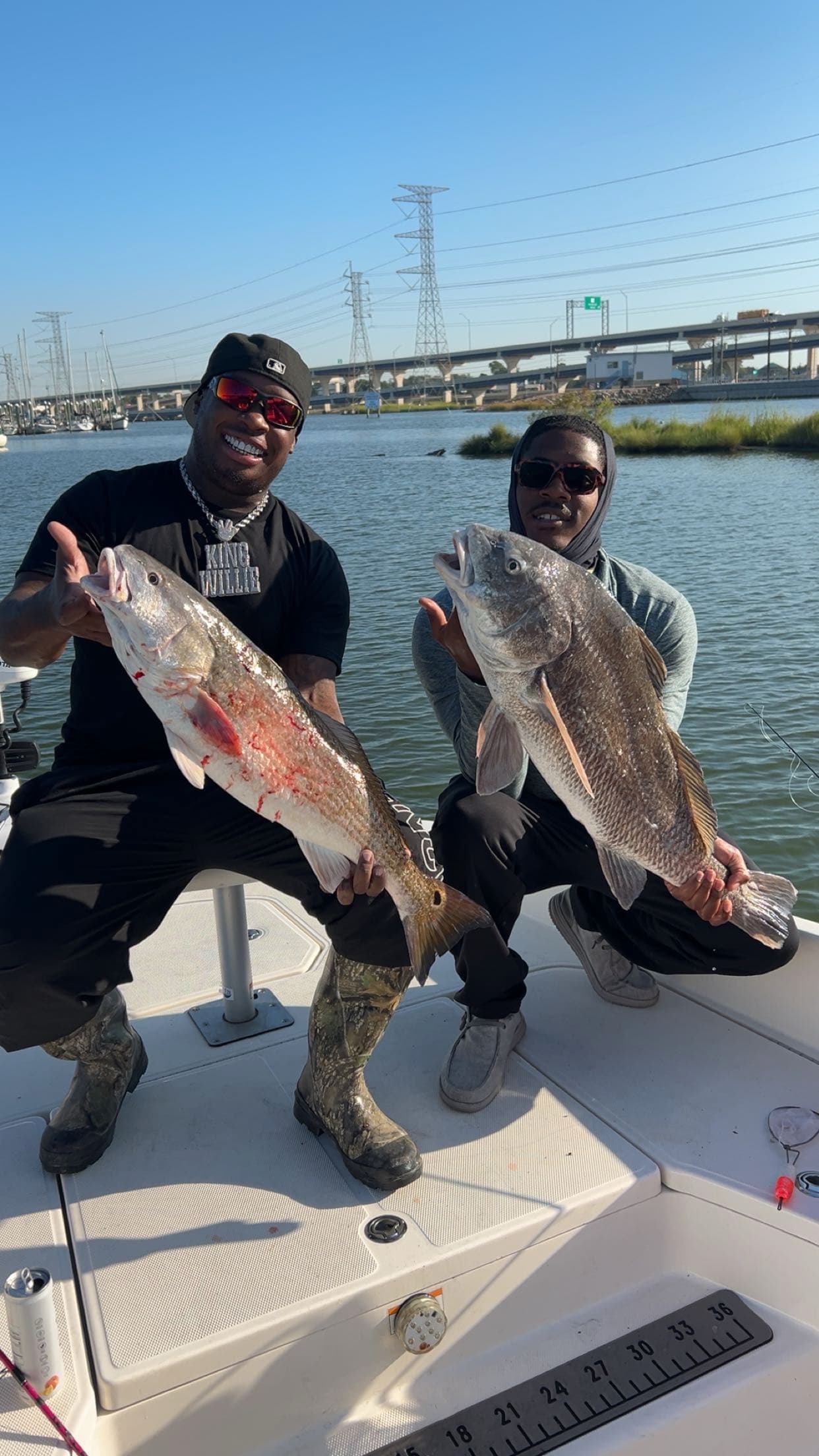 Two men with big fish