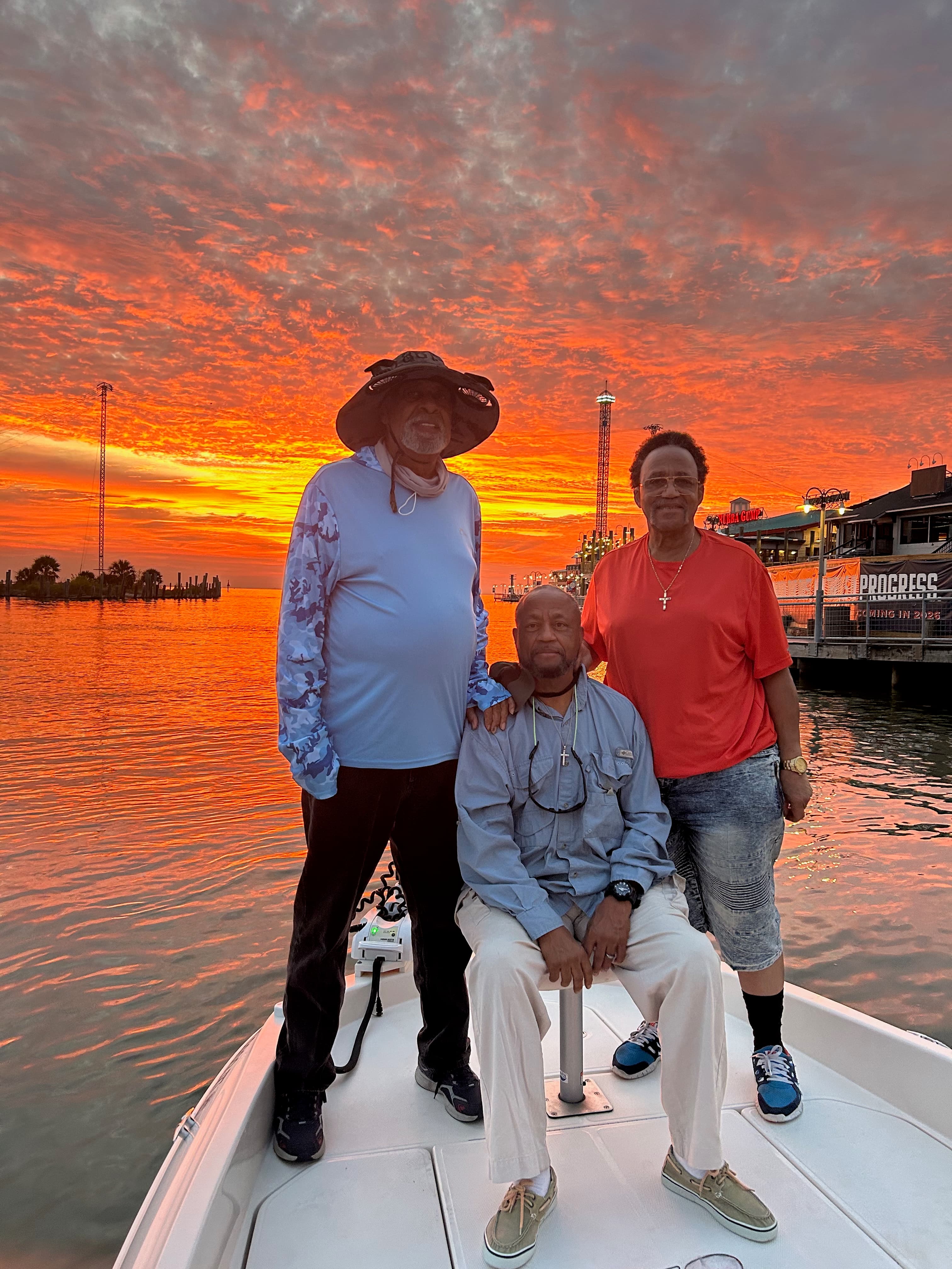 Family on a boat at sunset
