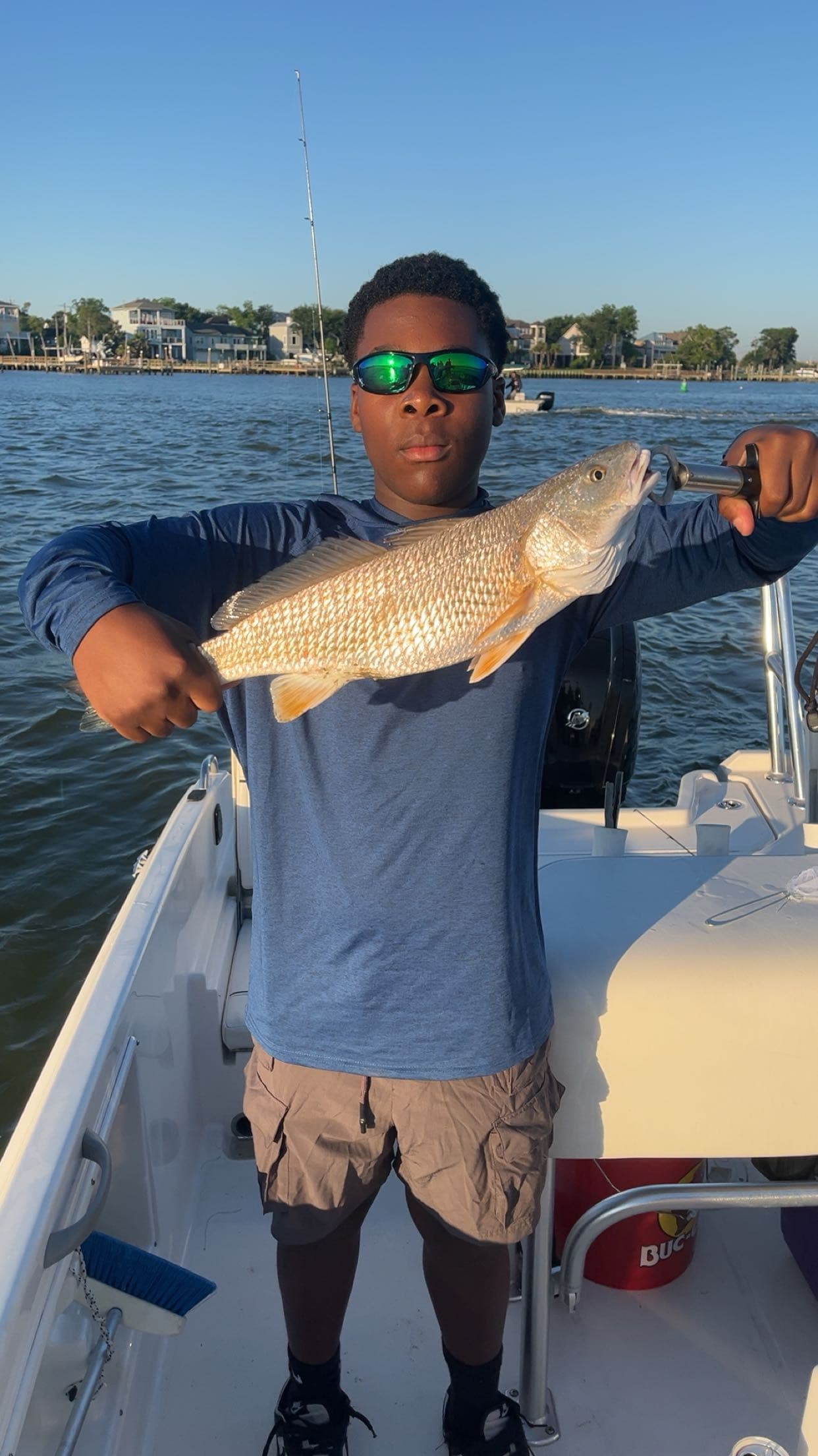 Young Boy holding Fish